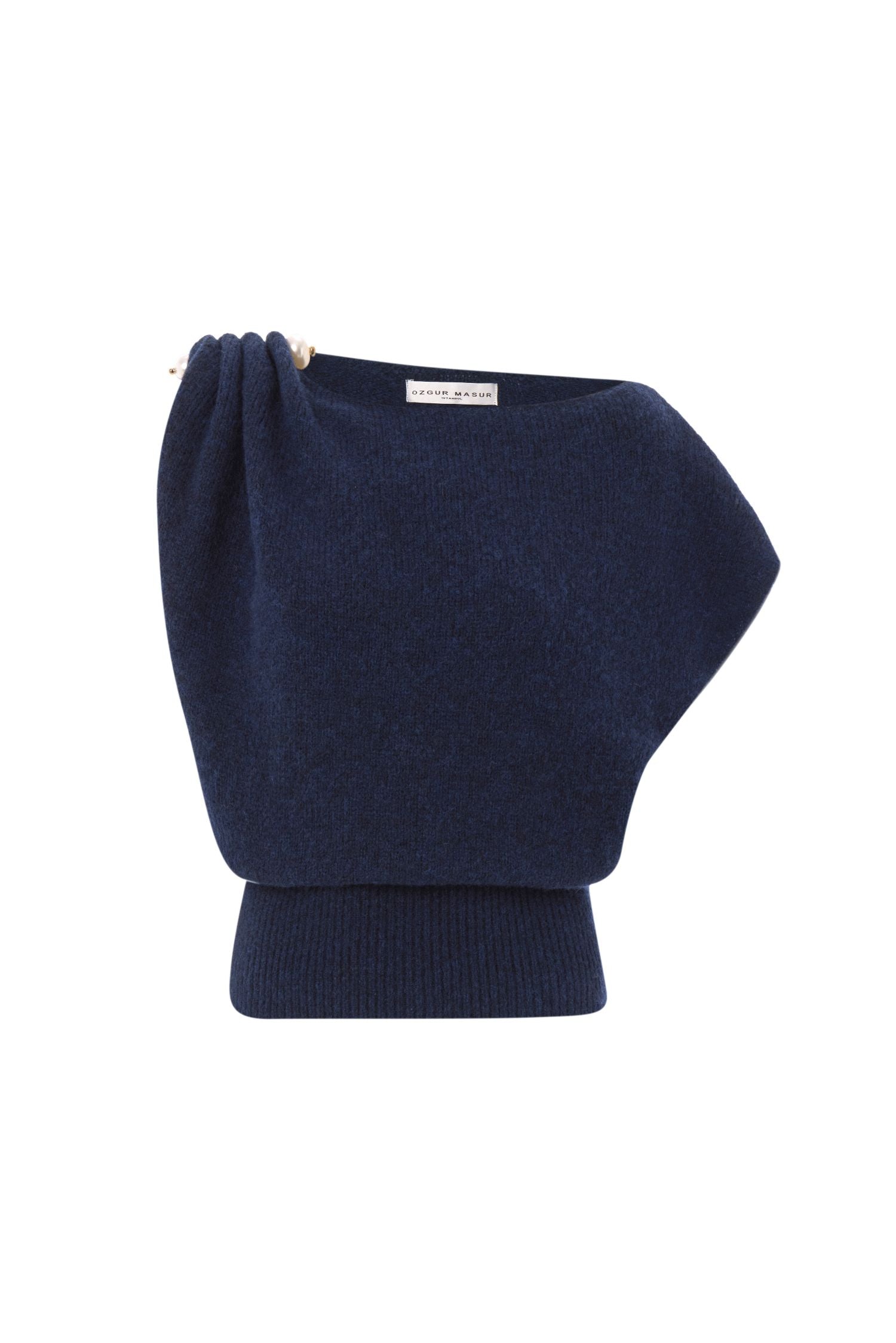 Soft knit asymmetric shoulder top with pearl accessory.