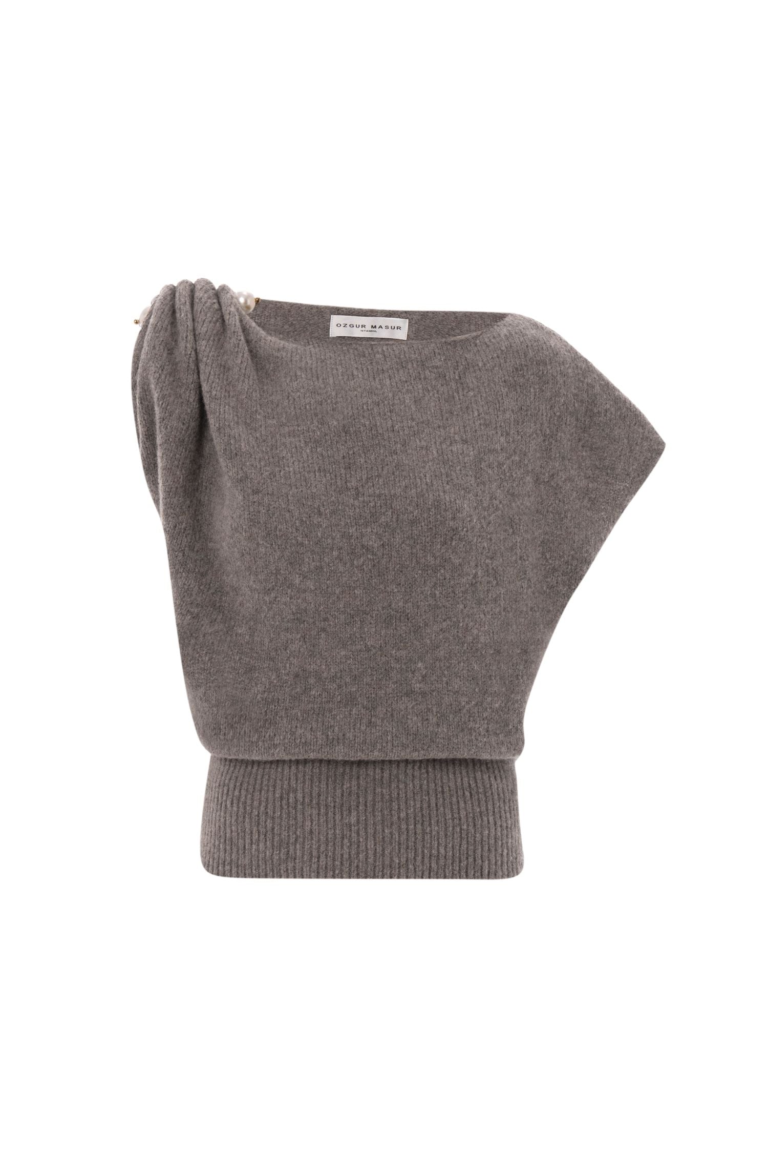 Soft knit asymmetric shoulder top with pearl accessory.